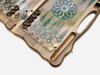 The open backgammon layout with wooden checkers