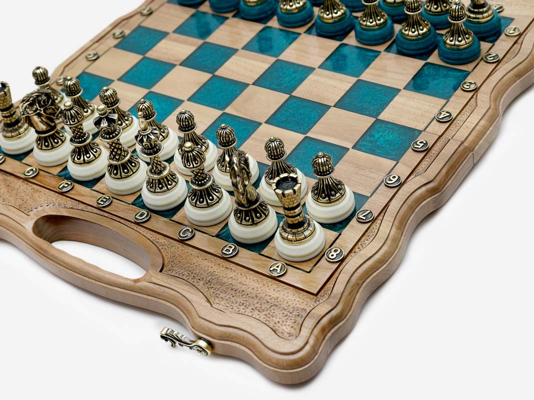 The turquoise epoxy chess set shown closed and ready to carry
