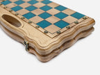 Close-up of the glossy turquoise squares, pale maple light squares and bronze coordinate markers