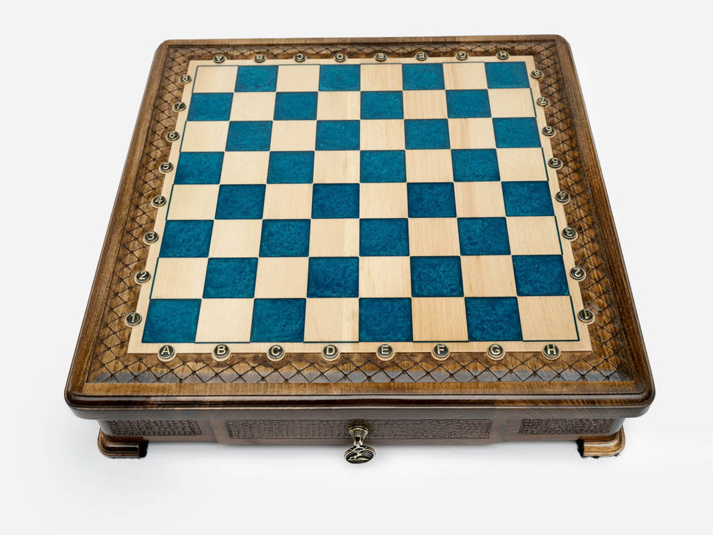 Blue epoxy chess set set up for play, straight front view