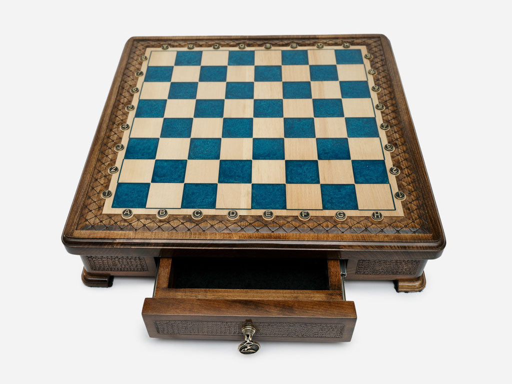 Blue epoxy chess set set up for play, angled view