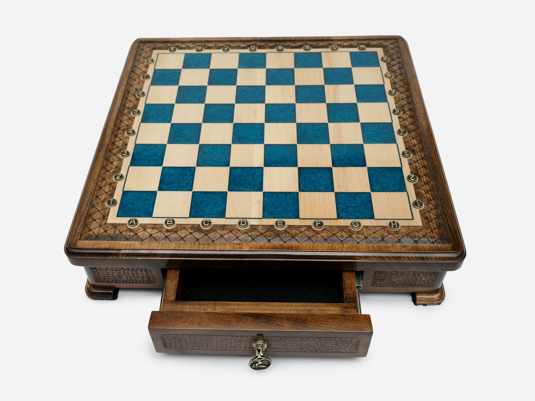 Blue epoxy chess set set up for play, angled view