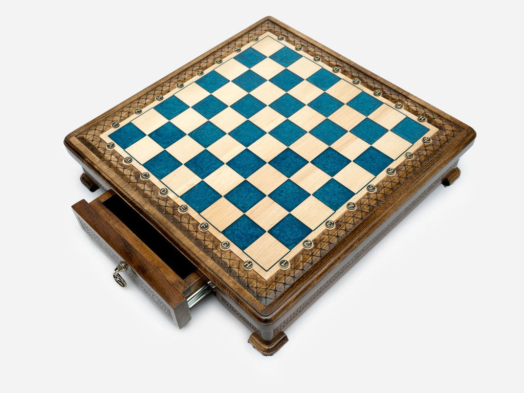 Blue epoxy chess set closed, angled view showing the drawer and feet