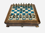 Blue epoxy chess set with bronze pieces set up for play, front view