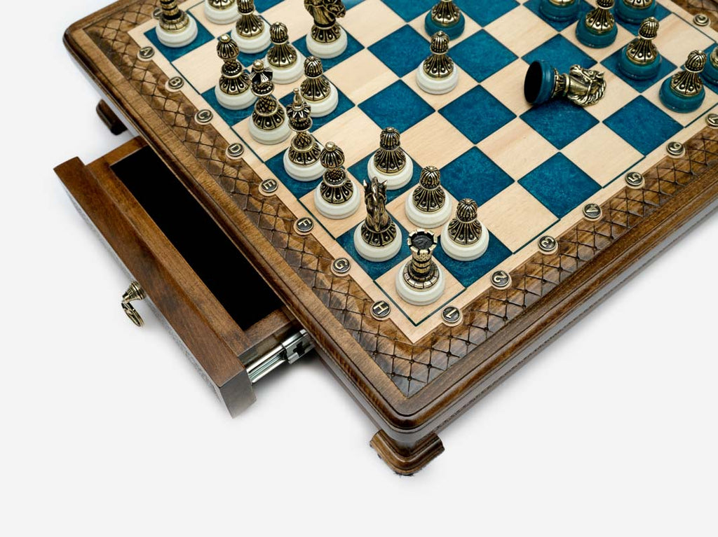 Close-up of the blue epoxy chess set drawer corner with bronze pieces