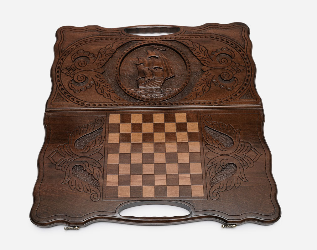 Angled view of the sailing ship carved backgammon board