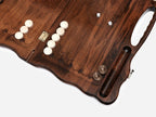 The backgammon board opened to show the wooden playing surface