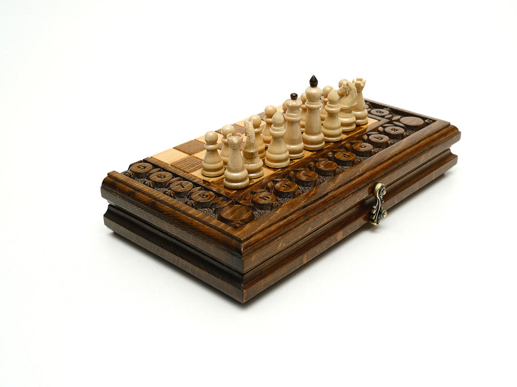 Handmade wooden chess set with carved fruit and vine ornament - detail