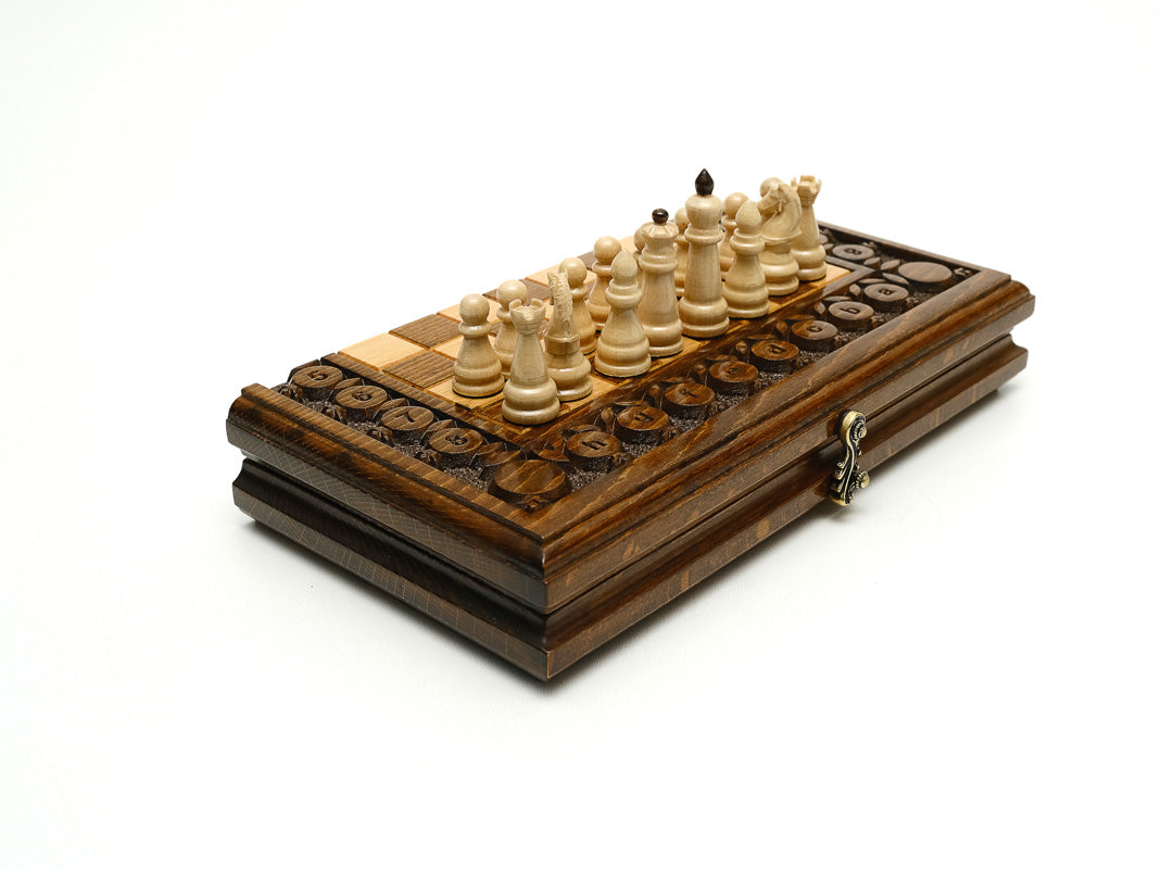 Handmade wooden chess set with carved fruit and vine ornament - detail