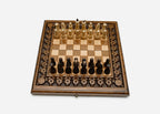Pomegranate and grapevine hand-carved on a wooden chess board - detail