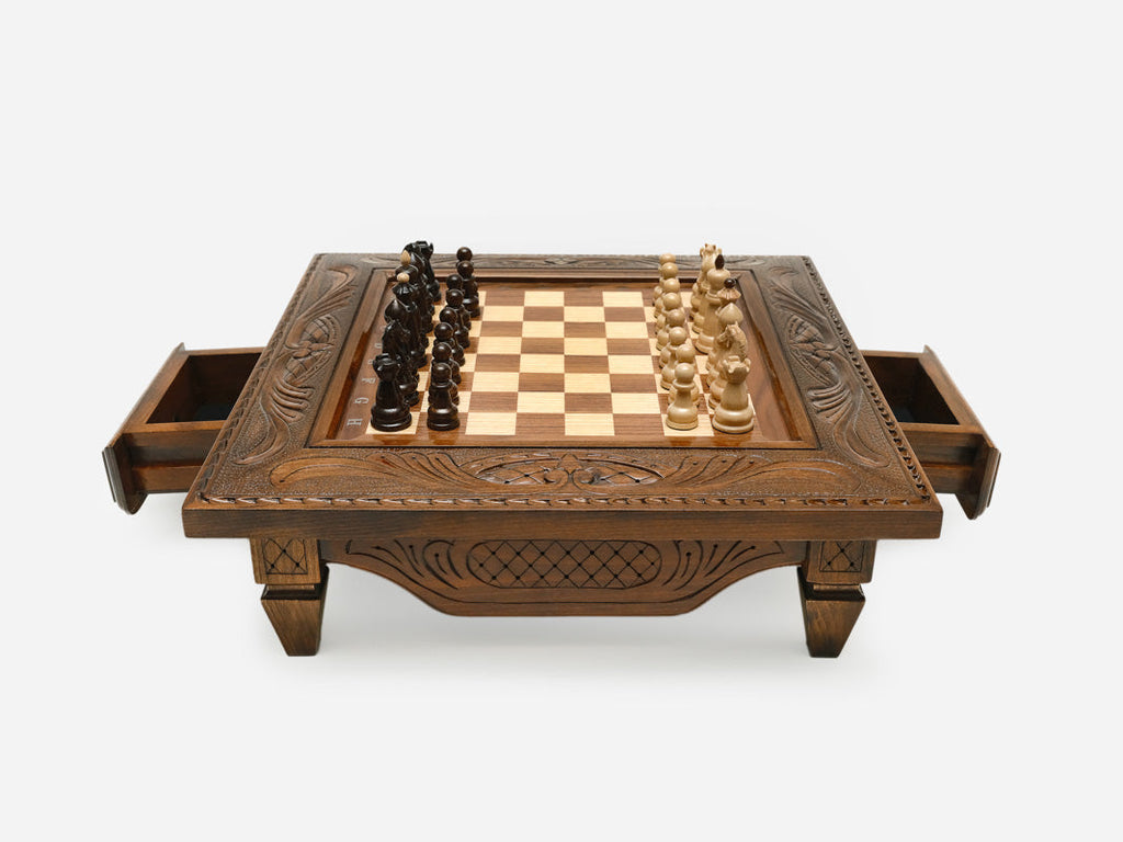 Carved chess set with both side drawers open, front view