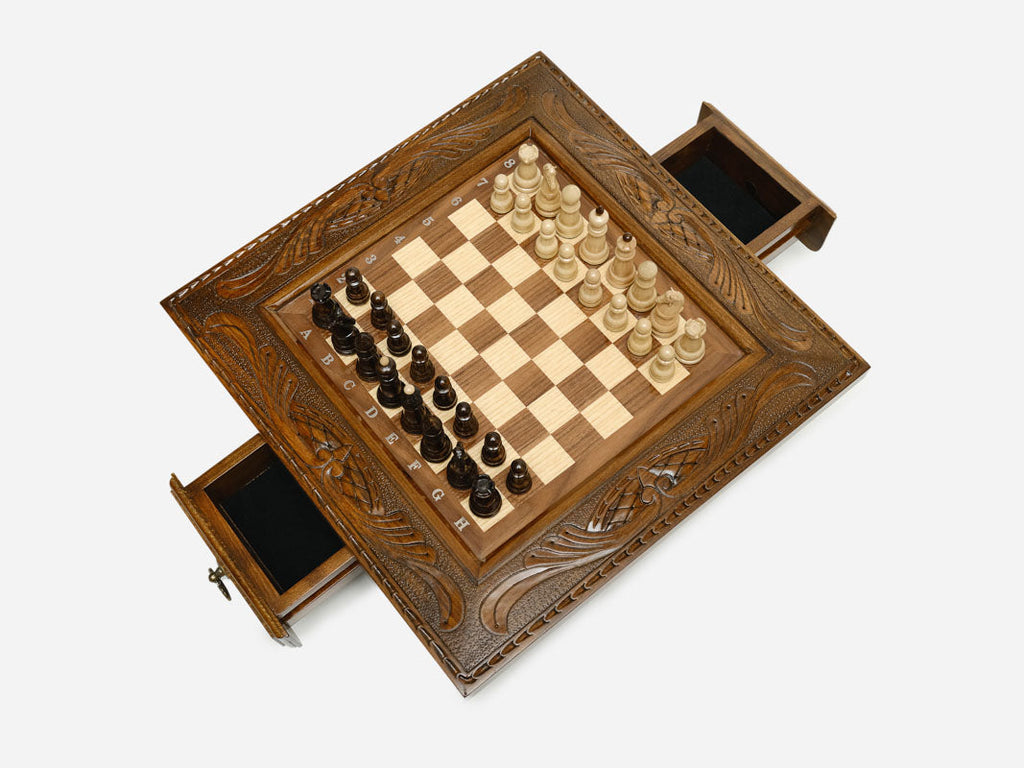 Carved chess set top-down view with both side drawers open