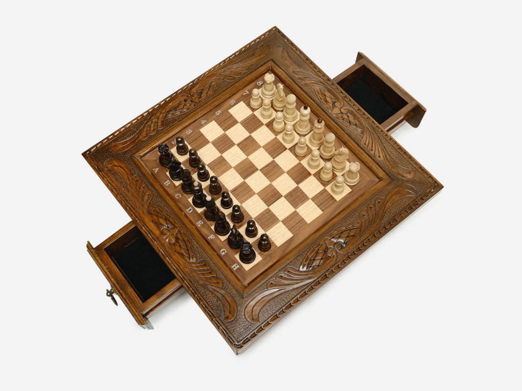 Carved chess set top-down view with both side drawers open