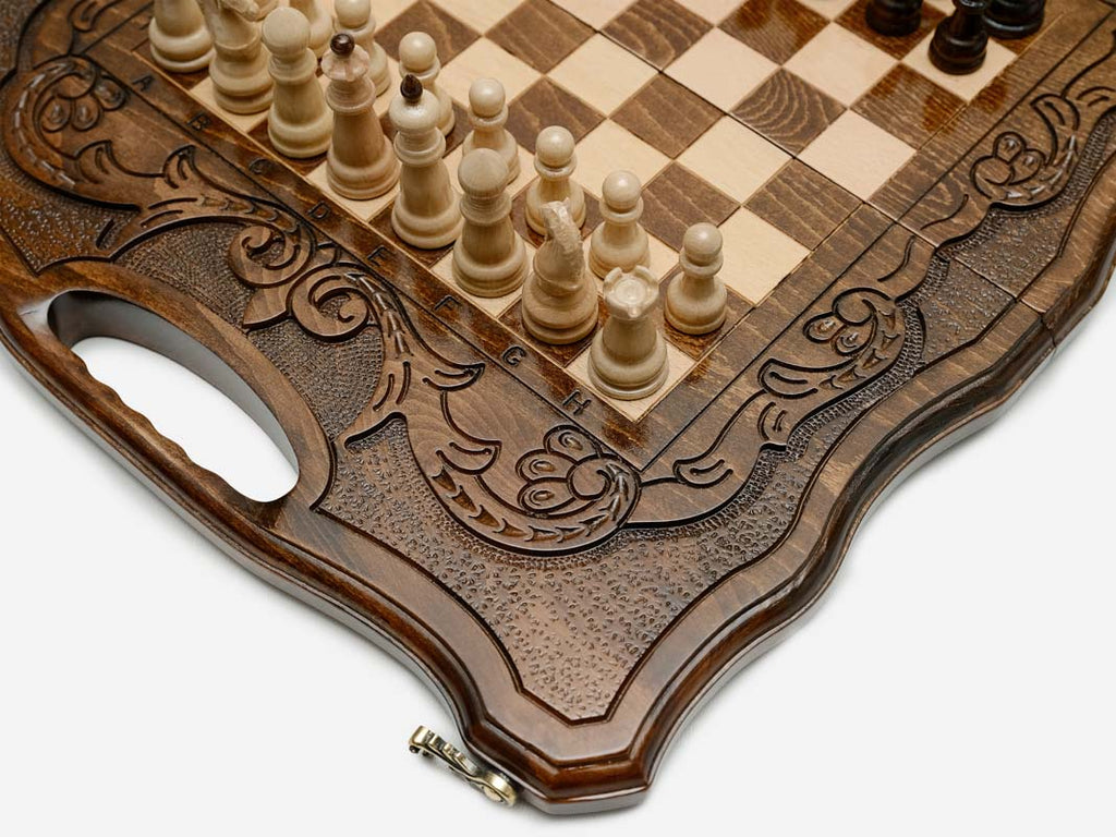 The board partly closed, showing its case form and carved handle