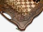The board partly closed, showing its case form and carved handle