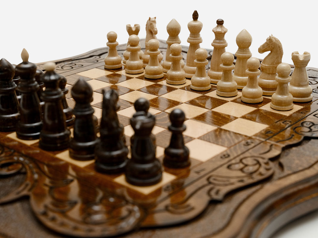 Detail of the turned chess pieces on the maple and walnut inlaid squares