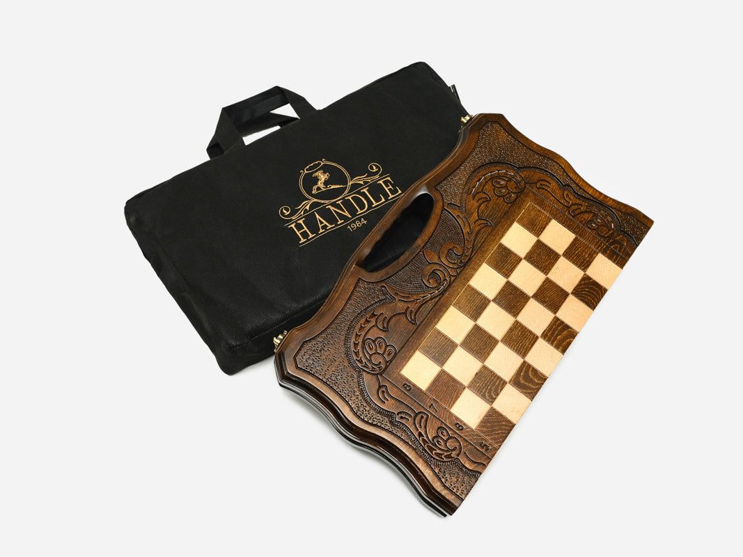 The carved walnut chess set shown closed and ready to carry