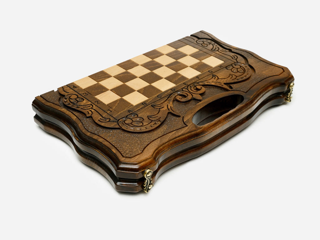 Overhead view of the walnut chess board with light and dark pieces in starting position