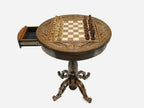 Round chess table with open storage drawer and chess pieces in starting position