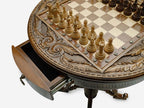 Close-up of the carved apron, inlaid chessboard and brass notation markers
