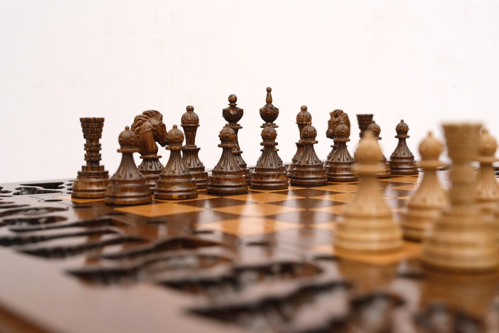 Octagon chess table, hand-cut geometric carving detail