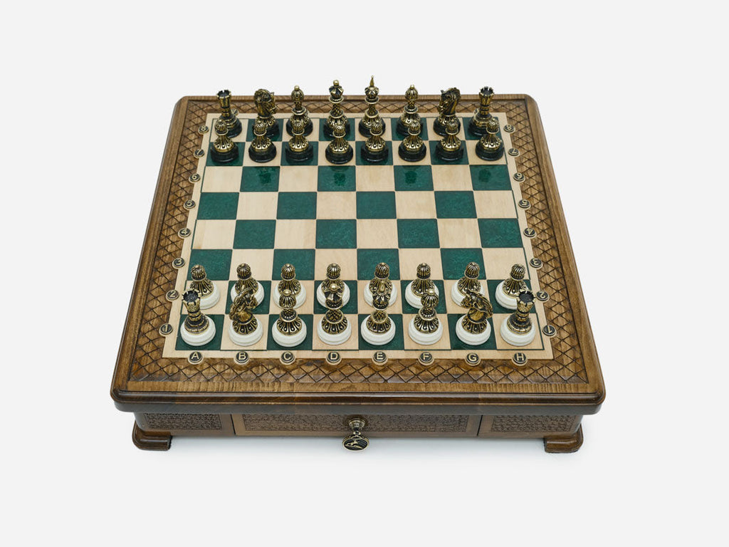 Green epoxy chess set set up for play, straight front view