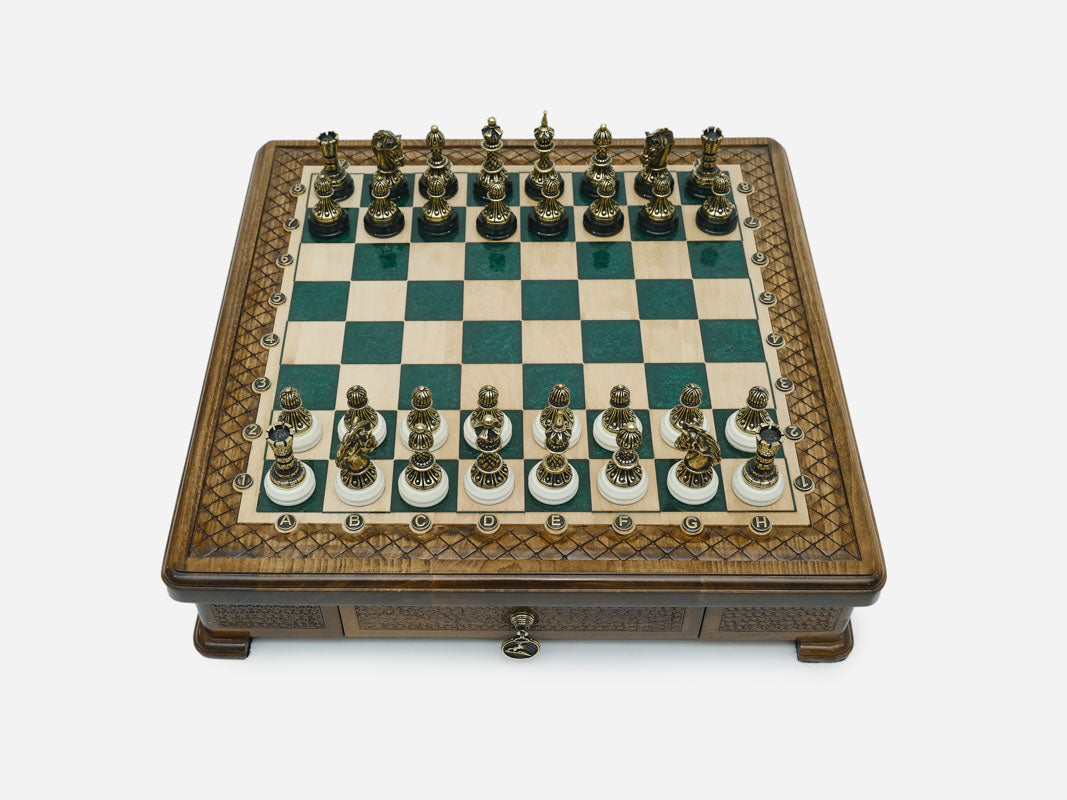 Green epoxy chess set set up for play, straight front view