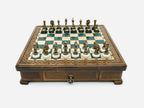 Green epoxy chess set with bronze pieces set up for play, front view