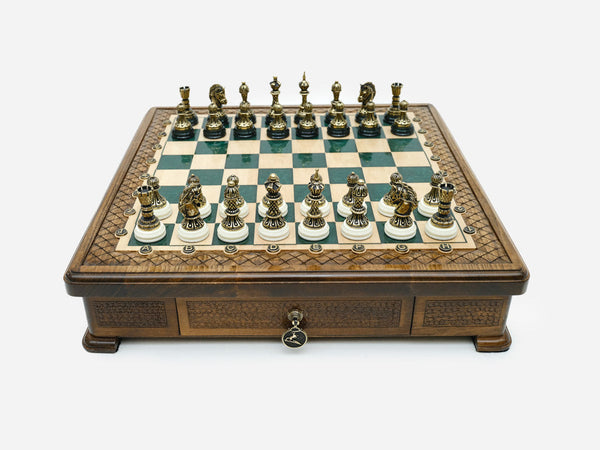 Green epoxy chess set with bronze pieces set up for play, front view