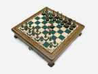 Green epoxy chess set set up for play, angled top-down view