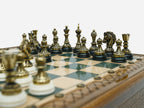 Close-up of the bronze chess pieces on the green epoxy board