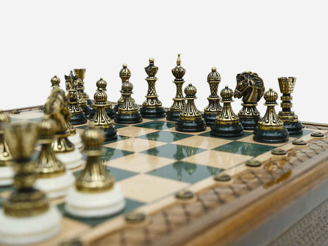 Close-up of the bronze chess pieces on the green epoxy board