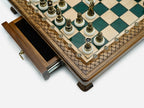 Close-up of the drawer corner and bronze chess pieces on the green epoxy set