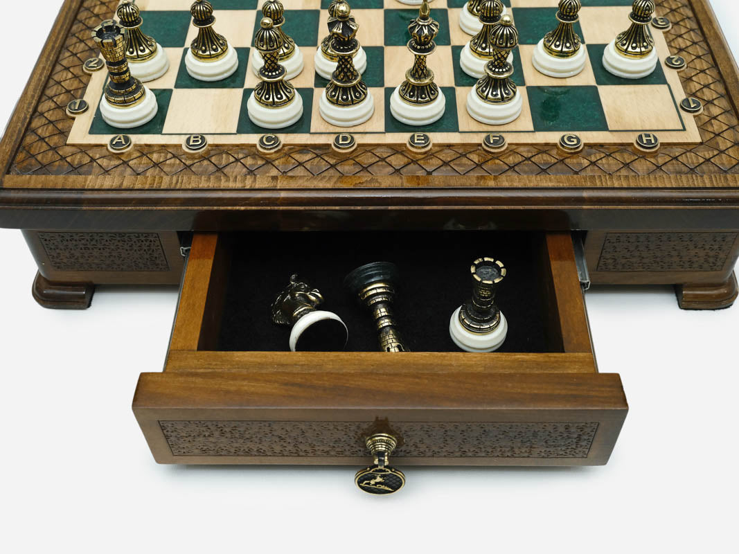 Close-up of the green epoxy chess set drawer with bronze pieces stored inside