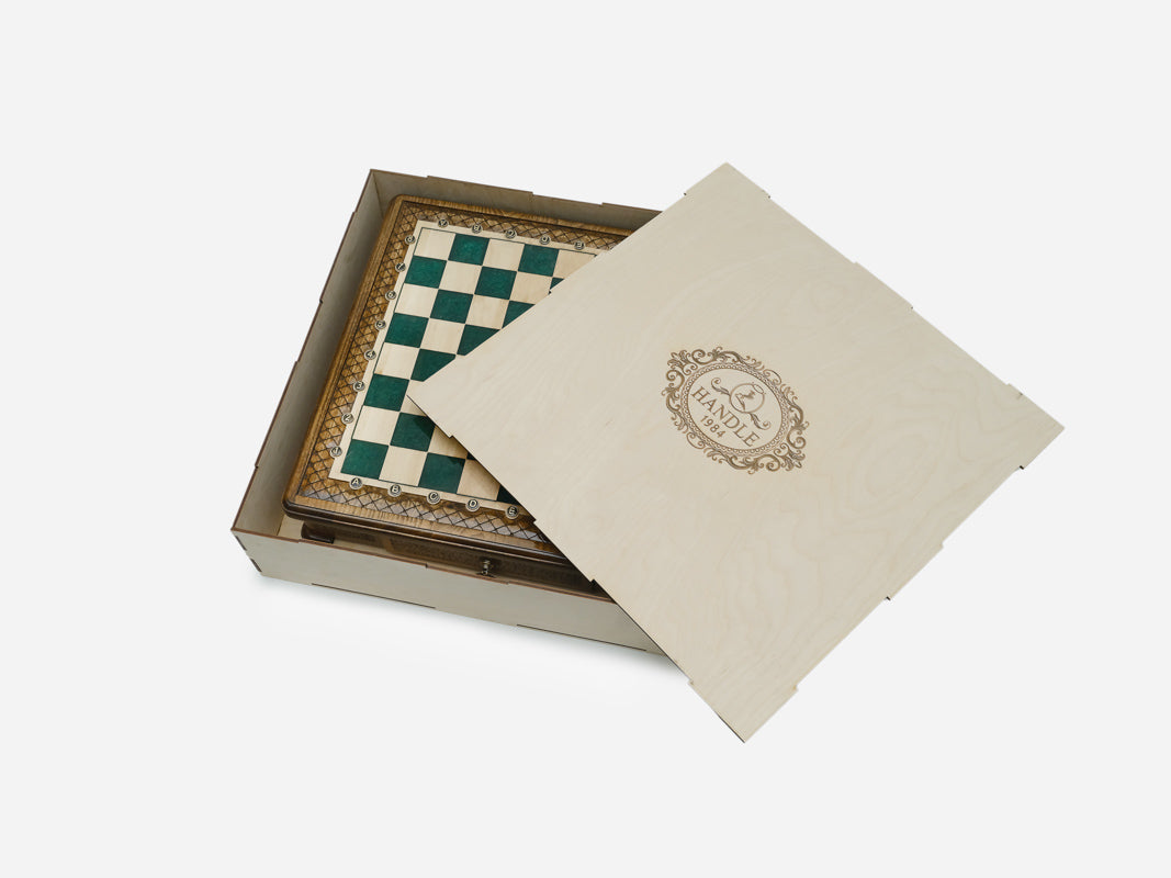 Green epoxy chess set packed in its wooden shipping crate