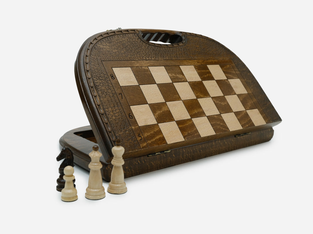 Arched-top folding chess backgammon set standing open, showing the chess face and built-in carry handle