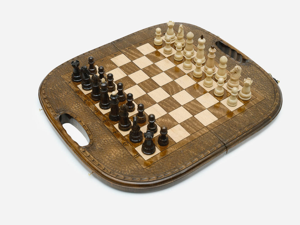 Close-up of the carved rope border and the arched top of the board