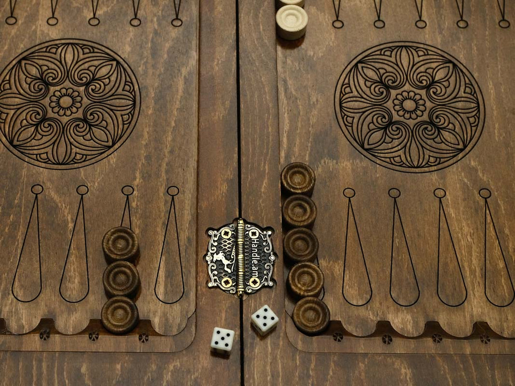 Close-up of the carved backgammon interior with its ornaments, wooden checkers and dice