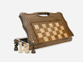 Classic folding chess set standing open, showing the playing face, carved lattice border and built-in carry handle