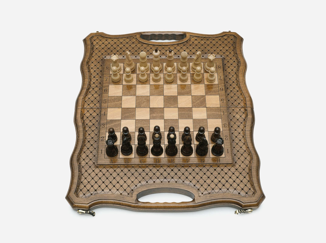 The folding chess board partly closed, showing its case form
