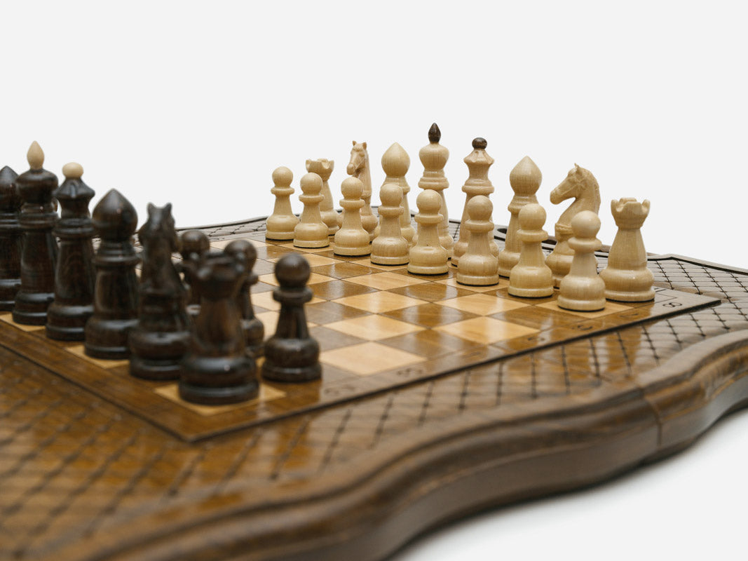 Top-down view of the opened board with the full set of light and dark wooden pieces