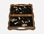 The carved travel chess set shown closed and ready to carry