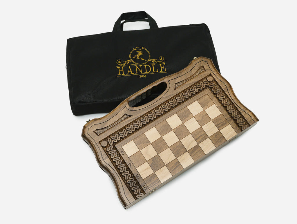 Side view of the closed carved chess board with its integrated handle