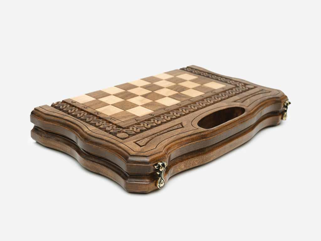 Interior of the opened board with carved detailing and a felt-lined base