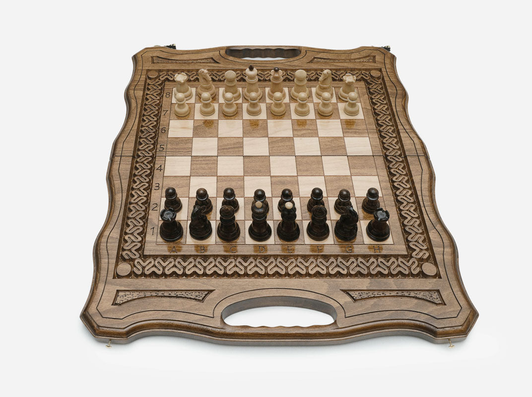 Detail of the turned beech and walnut chess pieces on the inlaid squares