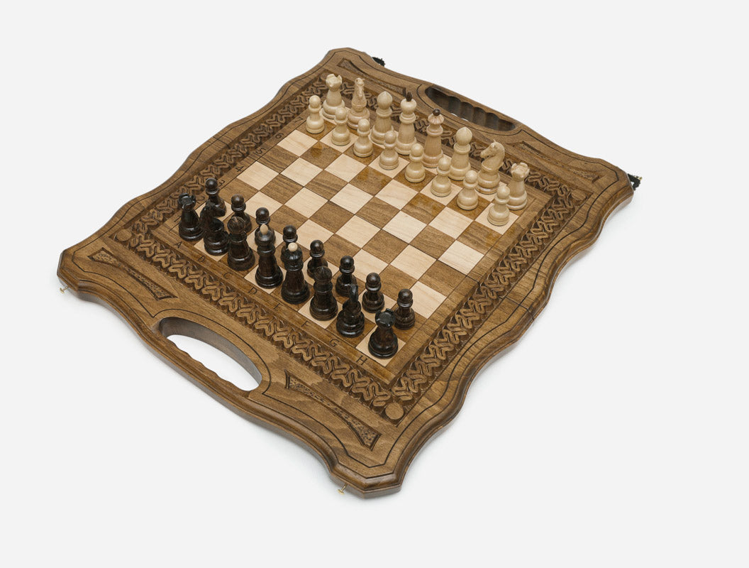 Angled view of the carved folding chess board set up for play