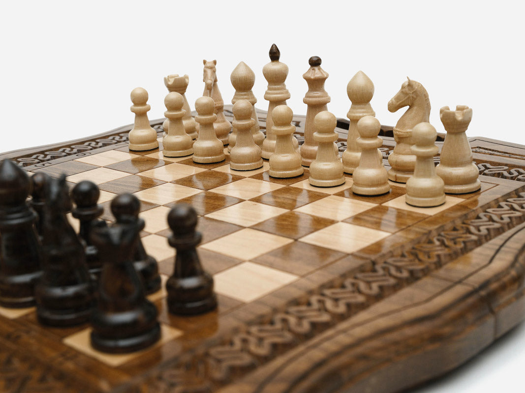 The folding chess set partly closed, showing its case form