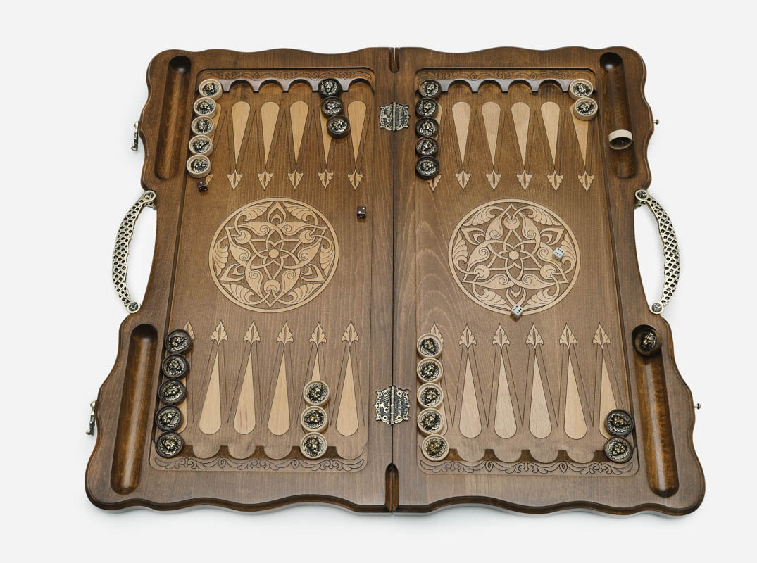 The ornate cast bronze carry handle fitted to the board