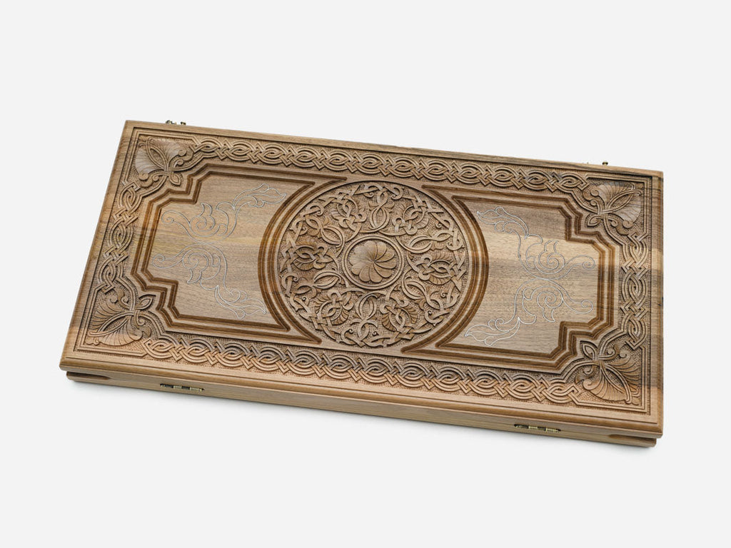 Close-up of the walnut grain and the silver inlay against it