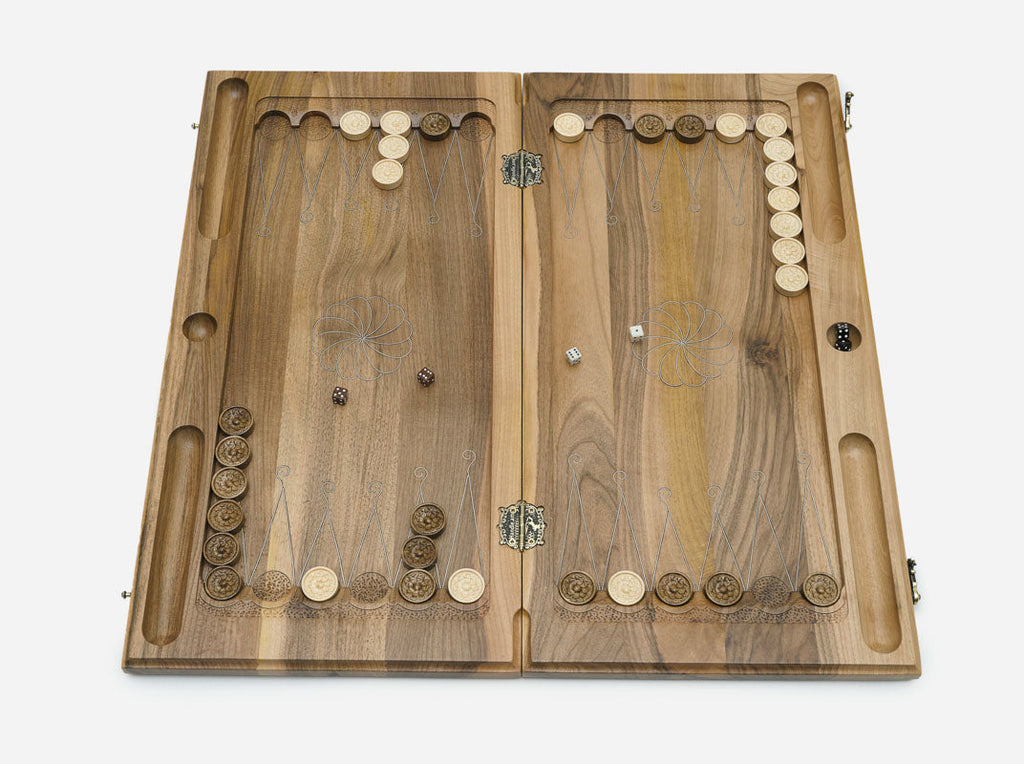 Detail of the silver inlaid into channels cut in the walnut